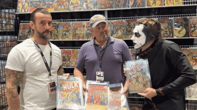 Three Men In Front Of Comic Book Wall GIF