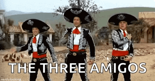 Three Men In Mariachi Costumes Are Standing Next To Each Other In The Desert . GIF