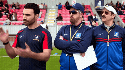 Three Men In Nike Jackets Standing On Field GIF