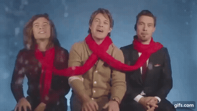 Three Men In Scarves Sitting Together GIF