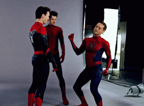 Three Men In Spiderman Costumes Are Dancing Together GIF