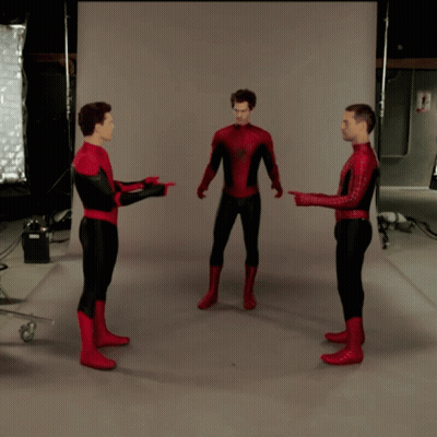 Three Men In Spiderman Costumes Are Standing In A Circle And Pointing At Each Other GIF