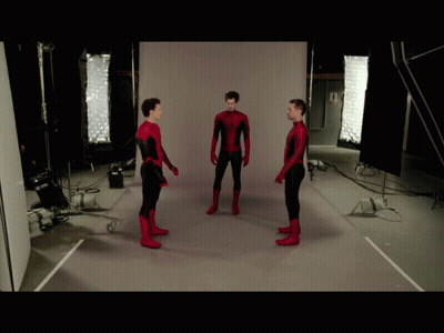 Three Men In Spiderman Costumes Are Standing In Front Of A White Wall GIF