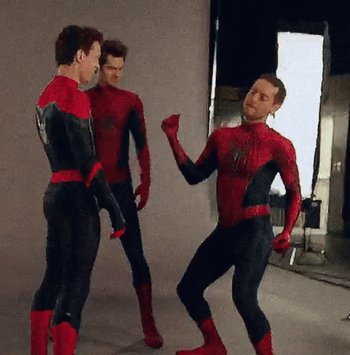 Three Men In Spiderman Costumes Are Standing Next To Each Other And Dancing . GIF