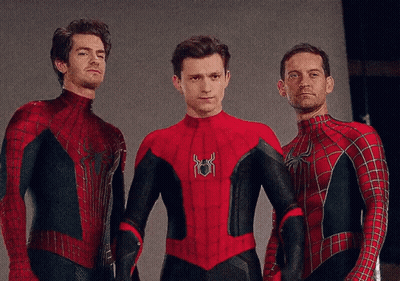 Three Men In Spiderman Costumes Pose For A Photo GIF