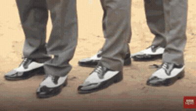 Three Men In Suits And Black And White Shoes GIF