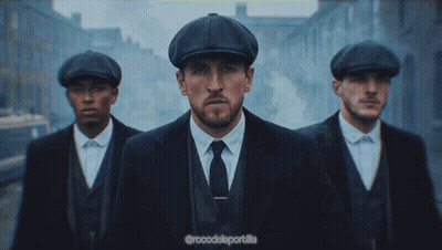 Three Men In Suits And Hats Are Walking Down A Street With The Caption @Rocodelaportalla GIF