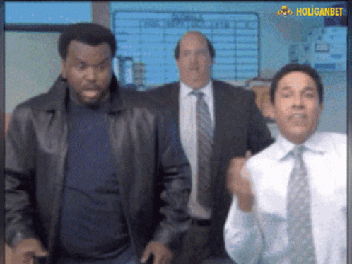Three Men In Suits And Ties Are Dancing In Front Of A Holiganbet Sign GIF