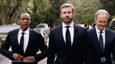 Three Men In Suits And Ties Are Standing Next To Each Other And The Nbc Logo Is Visible GIF