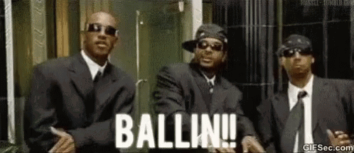 Three Men In Suits And Ties Are Standing Next To Each Other In Front Of A Building And They Are Dancing . GIF