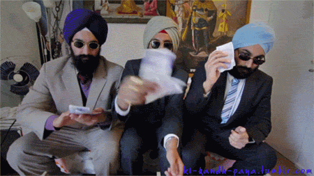 Three Men In Suits And Turbans Are Sitting In A Room GIF