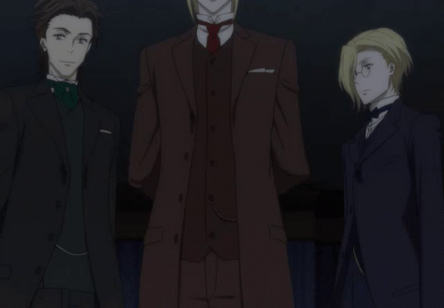 Three Men In Suits Are Standing Next To Each Other In The Dark GIF