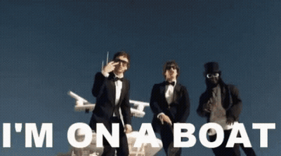 Three Men In Tuxedos Are Standing Next To Each Other With The Words I 'M On A Boat Written In White GIF
