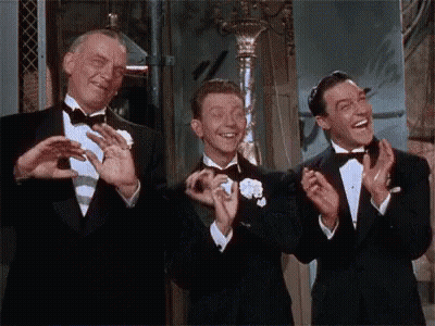 Three Men In Tuxedos Clapping GIF