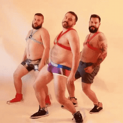 Three Men In Underwear Dancing In A Row GIF