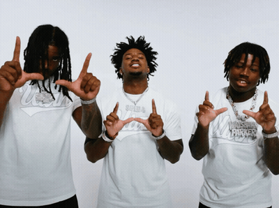 Three Men In White Shirts Saying Wisconsin Hawkers GIF