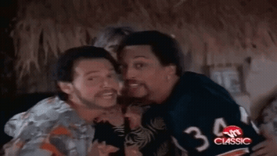 Three Men Laughing, One in Number 4 Jersey