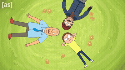 Three Men Laying in Grass With AS