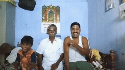 Three Men On Bed With Odia Calendar GIF