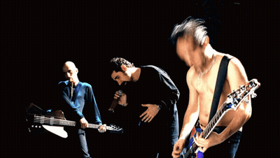 Three Men Playing Guitars In Front Of Crowd GIF