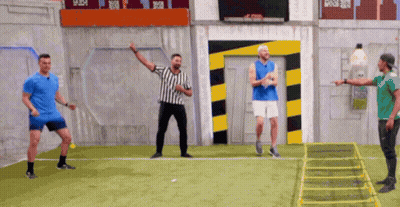 Three Men Playing Soccer With Referee GIF