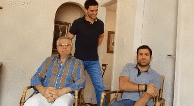 Three Men Posing One Wearing Glasses GIF