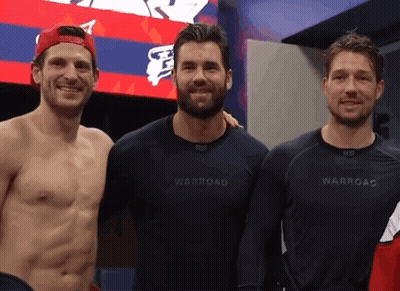 Three Men Posing One Wearing Warroad Shirt GIF