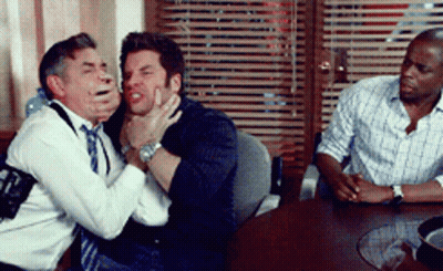 Three Men Sitting Around Table Holding Face GIF