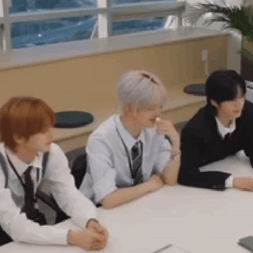 Three Men Sitting At Table GIF