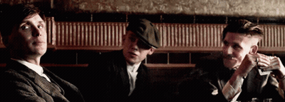Three Men Sitting At Table One Smoking GIF