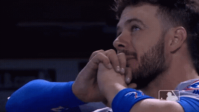 Three Men Sitting At Table With Boxing Gloves GIF