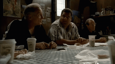 Three Men Sitting At Table With O'Reilly Cup GIF