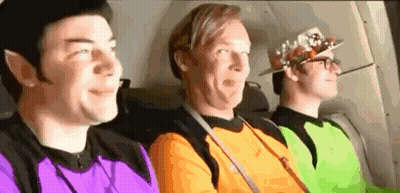 Three Men Sitting In Back Seat Of Plane GIF