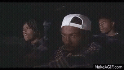 Three Men Sitting In Car Watching Movie One With White Hat GIF