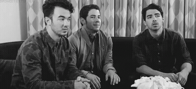 Three Men Sitting On Couch GIF