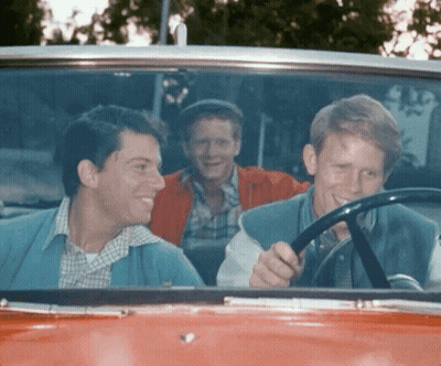 Three Men Smiling In Red Car GIF