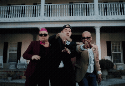 Three Men Standing In Front Of A House Pointing GIF