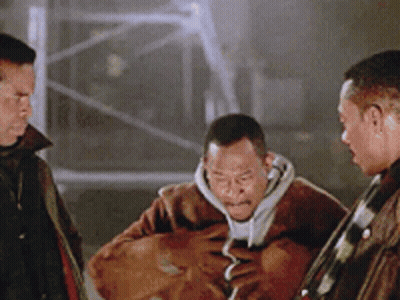 Three Men Standing One Holding Bag GIF