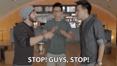 Three Men Standing One Holding Stop Guys Stop Cup