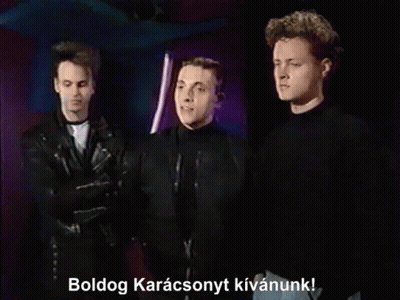 Three Men Standing Together Boldog Karacsonyt Kivanunk GIF