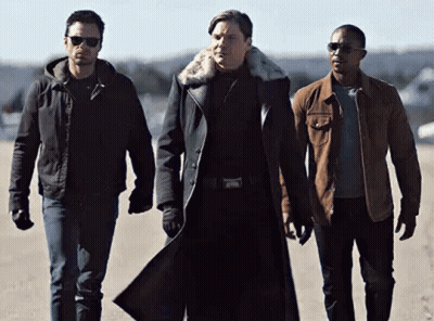 Three Men Standing Together On Dirt Road GIF