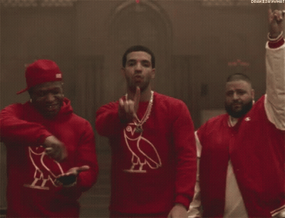 Three Men Wearing Red Sweaters With An Owl On Them Are Standing Next To Each Other . GIF