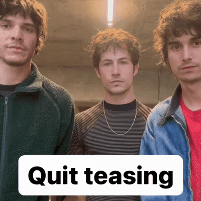 Three Men With Quit Teasing Sign GIF