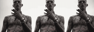 Three Men With Tattoos On Their Bodies Are Standing Next To Each Other With Their Hands On Their Faces GIF