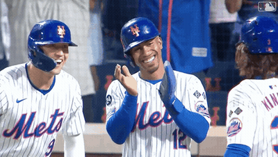 Three Mets Baseball Players Are Standing On The Field Laughing GIF