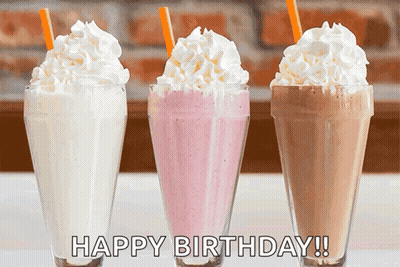 Three Milkshakes With Whipped Cream And Straws With The Words Happy Birthday Written On The Bottom GIF