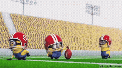 Three Minions Are Playing Football On A Field Wearing Helmets And Holding A Ball . GIF