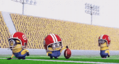 Three Minions Are Playing Football On A Field Wearing Helmets And Holding A Football . GIF