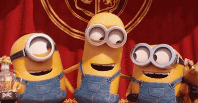 Three Minions In Overalls And Goggles Standing Together GIF