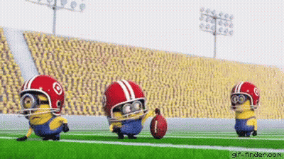 Three Minions Playing Football With Helmets And Ball GIF